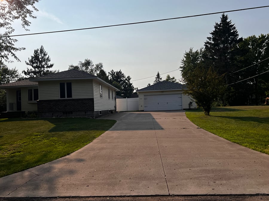 Front of house, driveway and garage