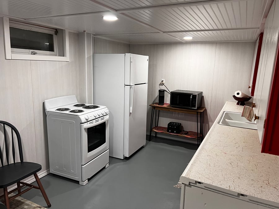 New kitchenette in lower level. Brand new stove and oven.