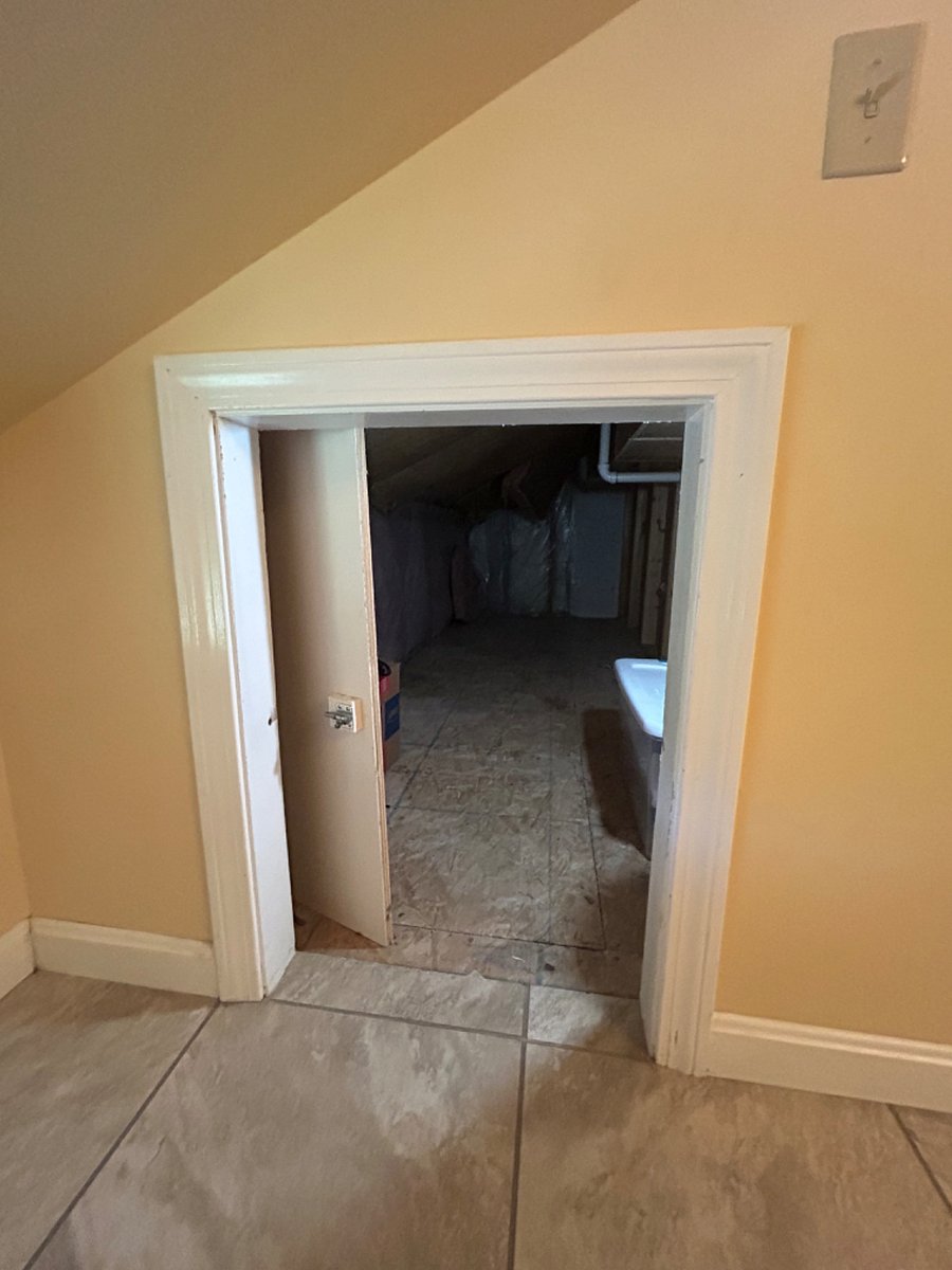 Enclosed storage area located in the bathroom.