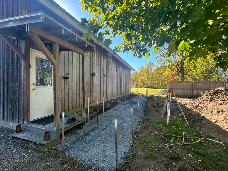 Coming soon! Construction underway to create fenced in walk way leading out to a private parking and firepit area.
