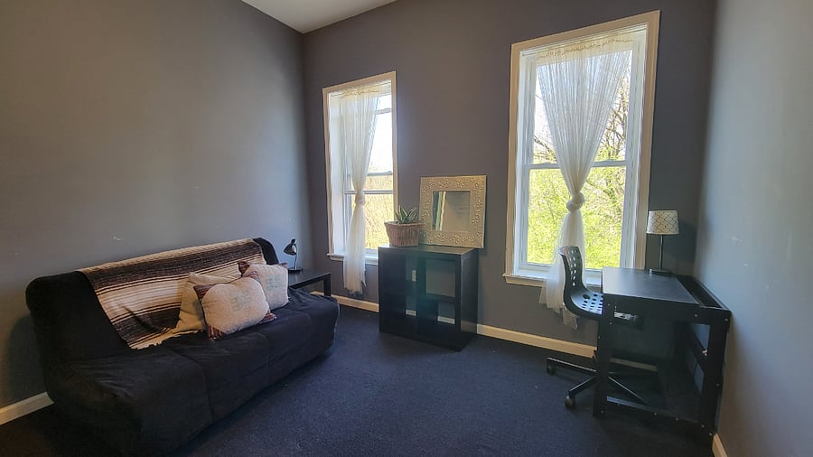 front bedroom with futon and small desk