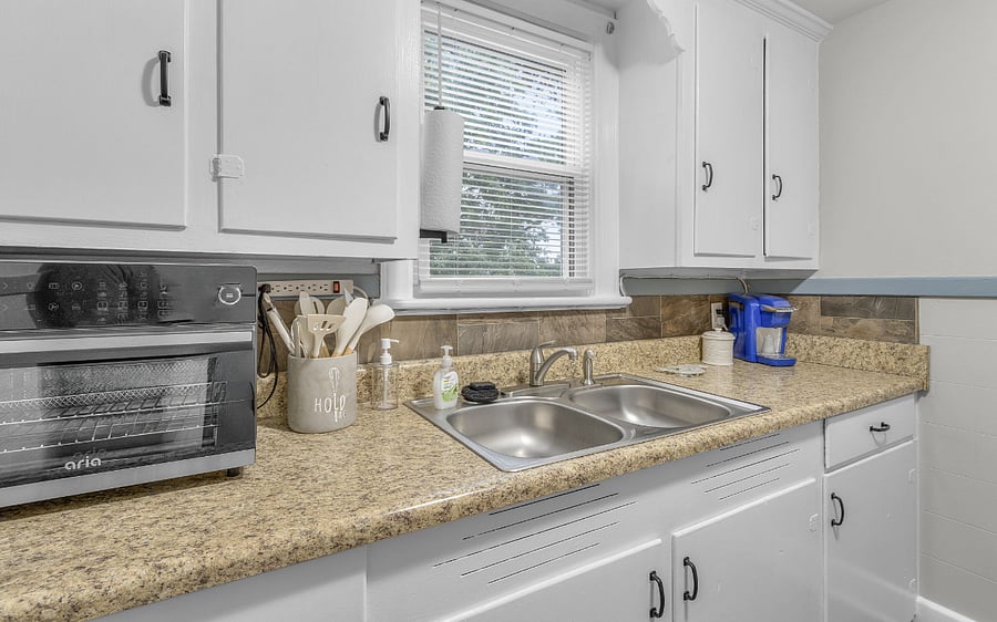 Kitchen has a countertop Air Fryer oven, coffee maker, full size fridge, and 2 induction burners with griddle for cooking. (crazy fast and only gets hot when a pan is place on the burner)