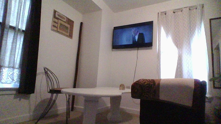 Bedroom # 1  love seat and table with 33" SMART Tv