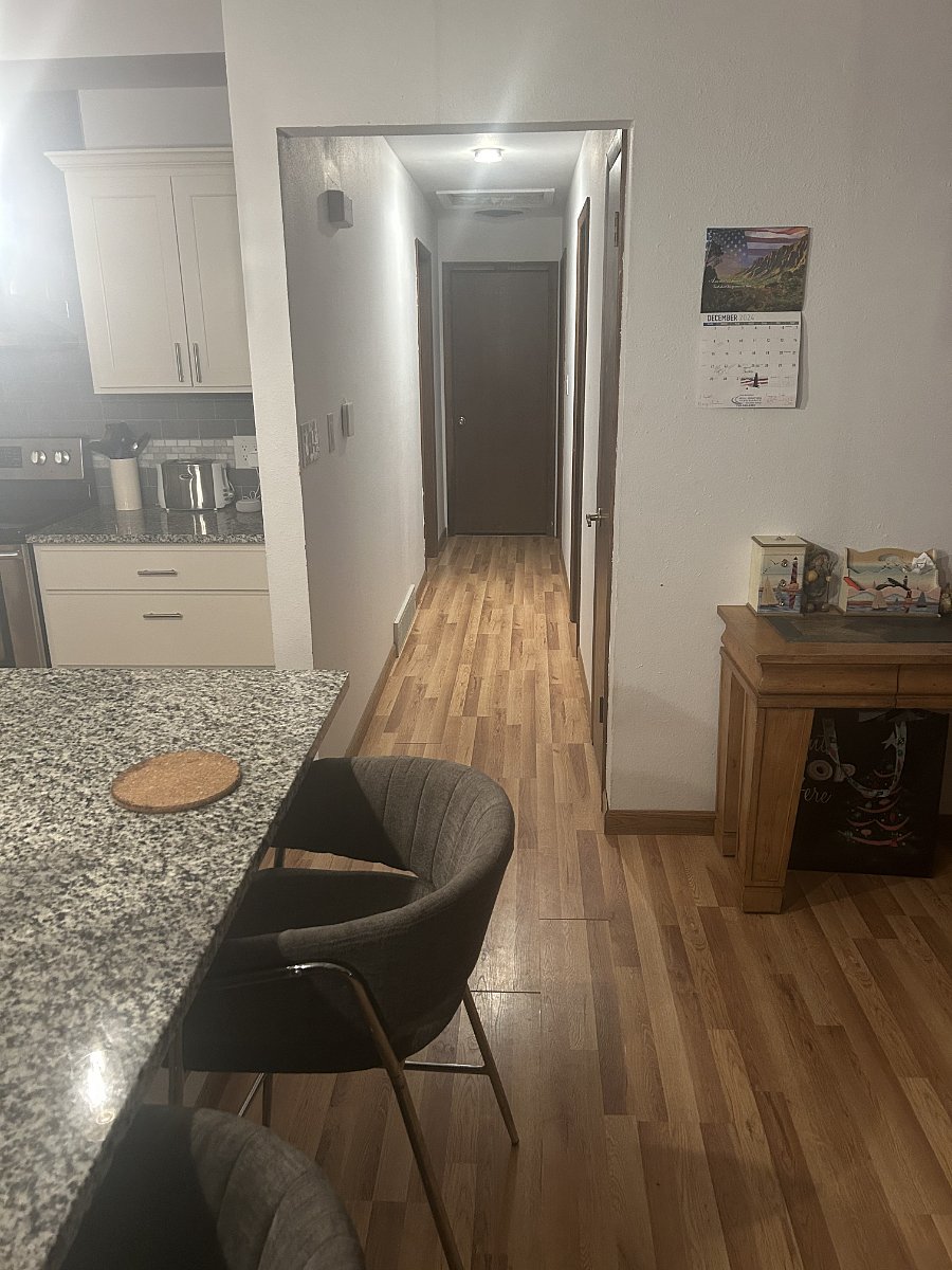 Hallway from living/front room to private rental bedroom