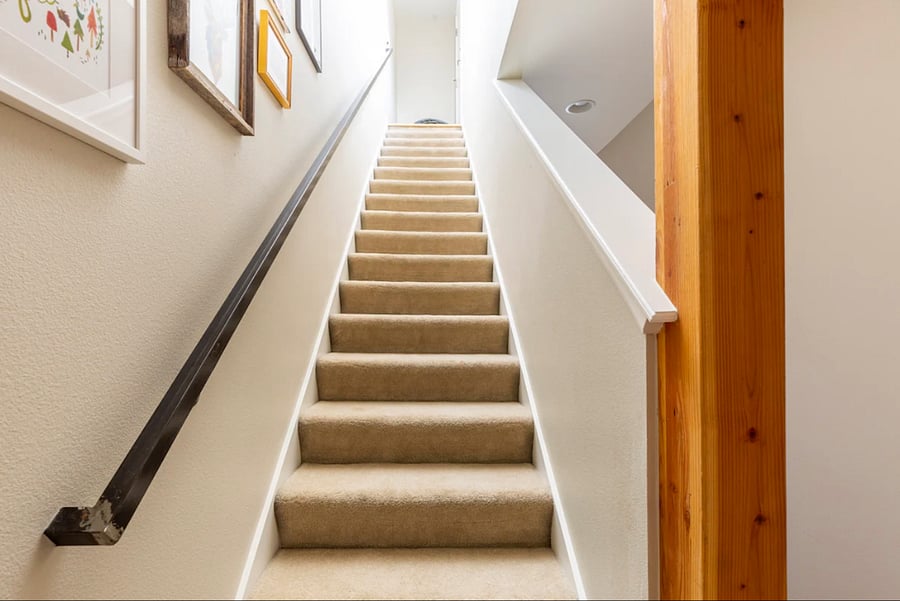 These carpeted stairs lead up to the rooftop deck.