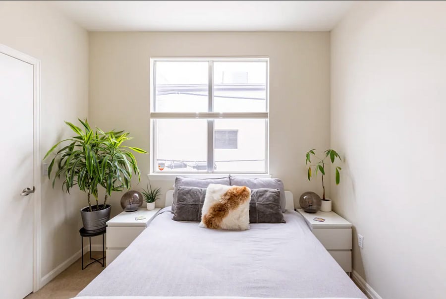 This is our guest bedroom, where you will be staying. It has a very comfortable queen bed as well as a walk-in closet to the left of the bed. The blinds can be adjusted so you can let as little or as much light into the room.