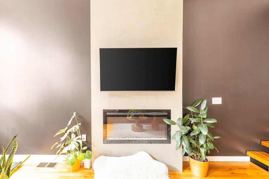 The faux fireplace underneath the TV adds nice ambiance to the room when you want a cozy night in.