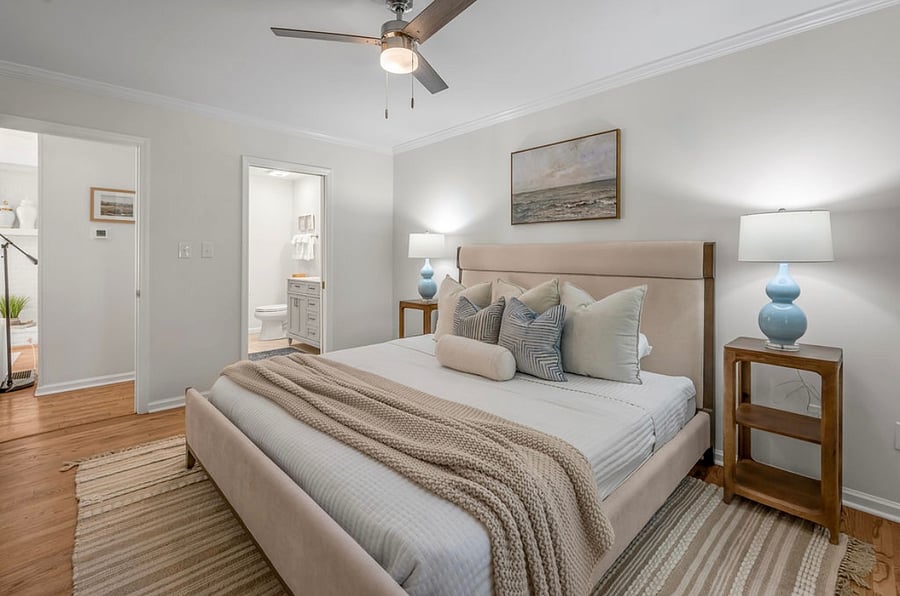 Main level King Suite looking into living area and adjoining bathroom and walk-in closet