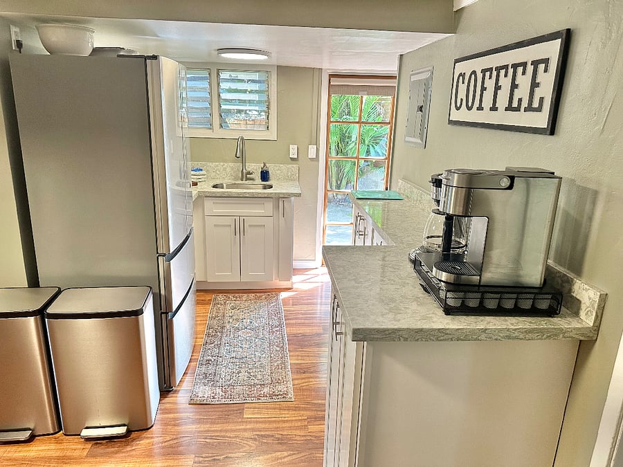 Full kitchen with door to lanai.
