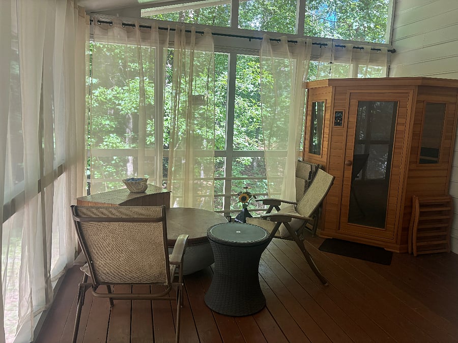 Spa amenities are found outdoors in a covered porch.  