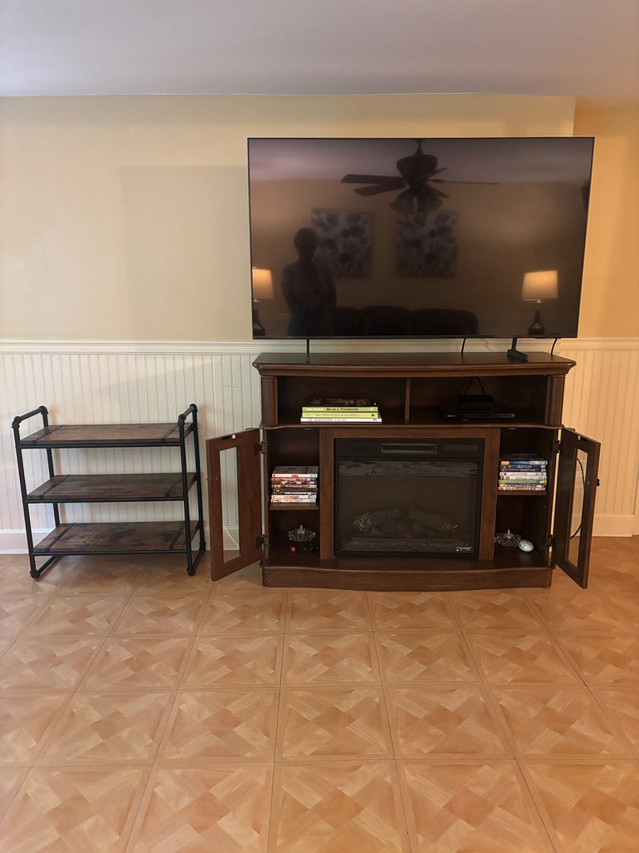 55 inch smart television in the living room and yes those are Dvd's you see and yes I do have a dvd player.  Ancient I know LOL!