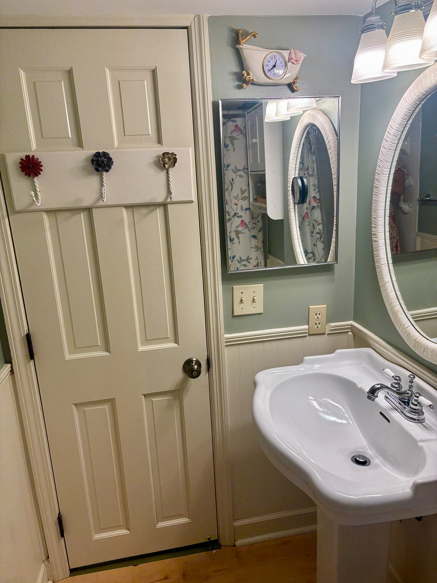 Bathroom door has hooks for towels, robes, ect, Medicine cabinet for personal belongings.