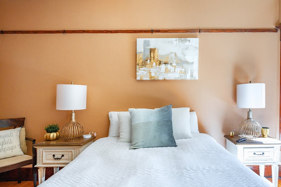 Queen bed with window seating.