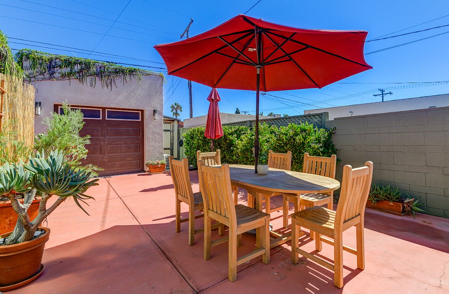Savor meals al fresco in our cozy backyard dining area.