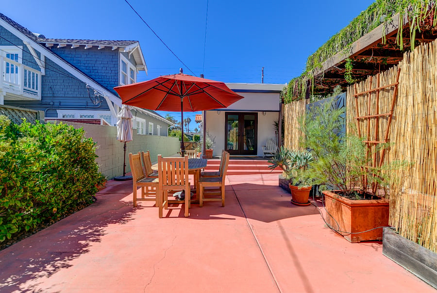 Savor meals al fresco in our cozy backyard dining area.