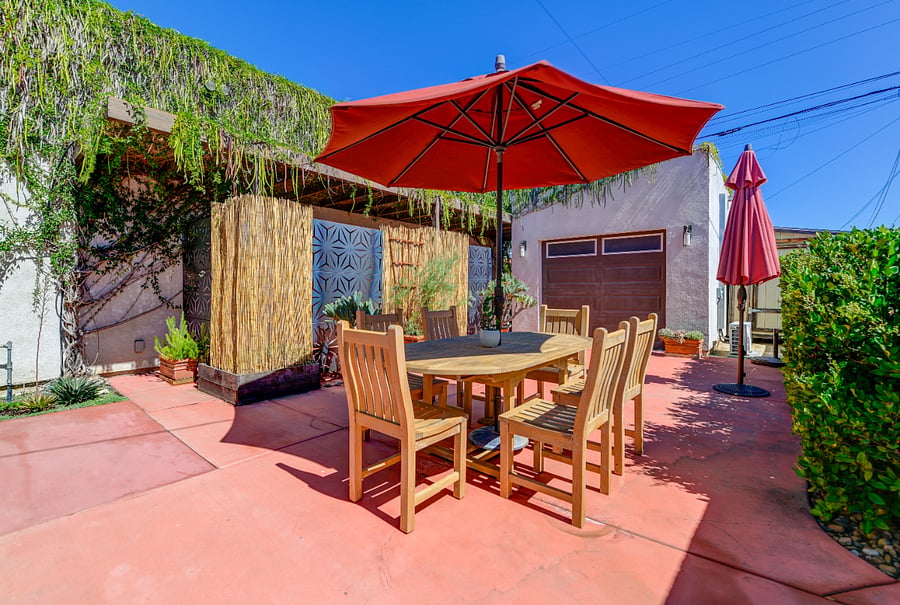 Savor meals al fresco in our cozy backyard dining area.