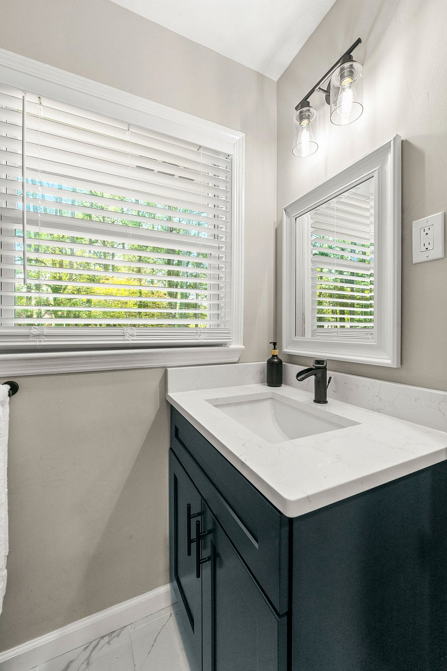 Full size bathroom with standing shower.