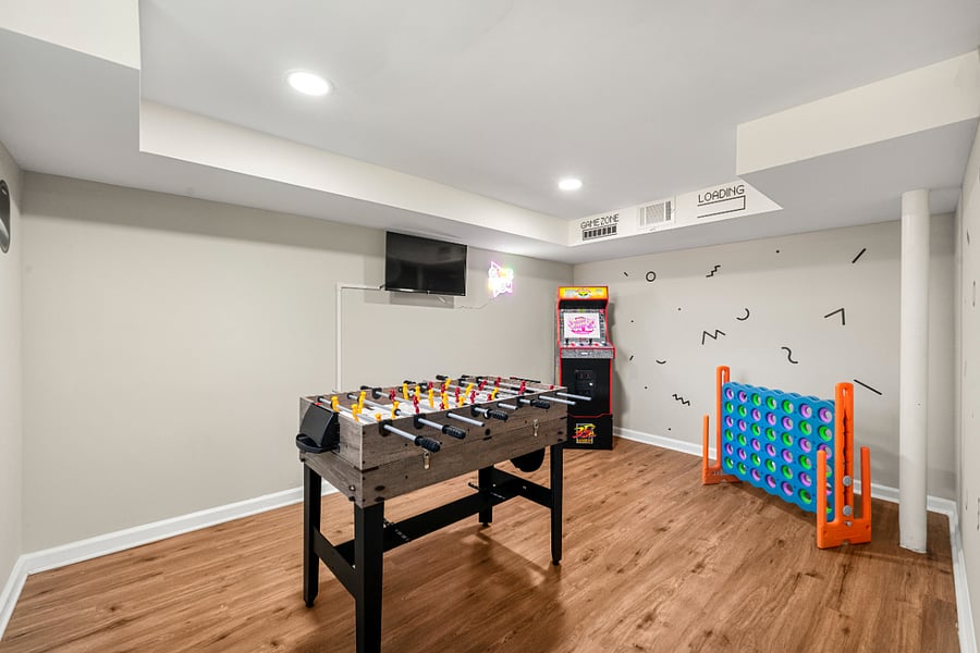 The game room features arcade games, a TV, a convertible foosball table and more!