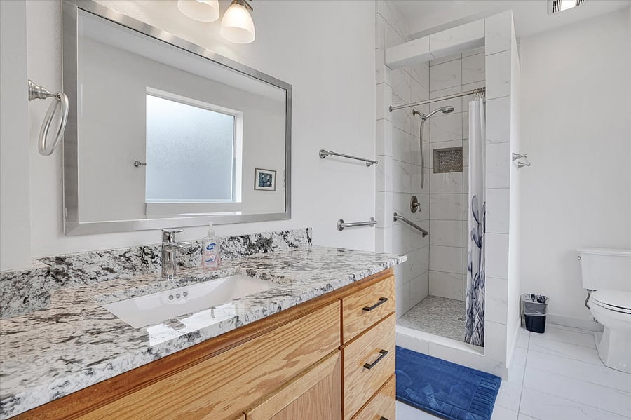 Full bath for bedroom #1. All bathrooms have step-in showers. No tubs.