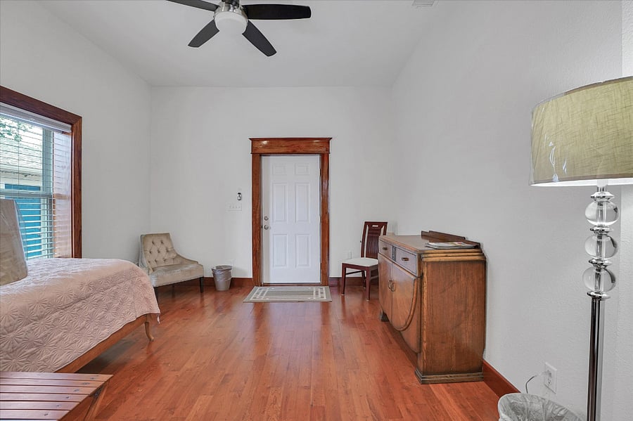 Bedroom #2. See the twin bed here and the separate exit to the driveway. Another twin bed could possibly be added here.