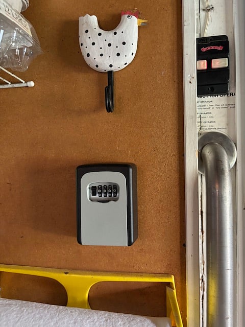 Lock box to keys to the house. There are two sets each for the kitchen door and the front entry way. The Halo Kwik set lock is located on the door to the right of the garage. 