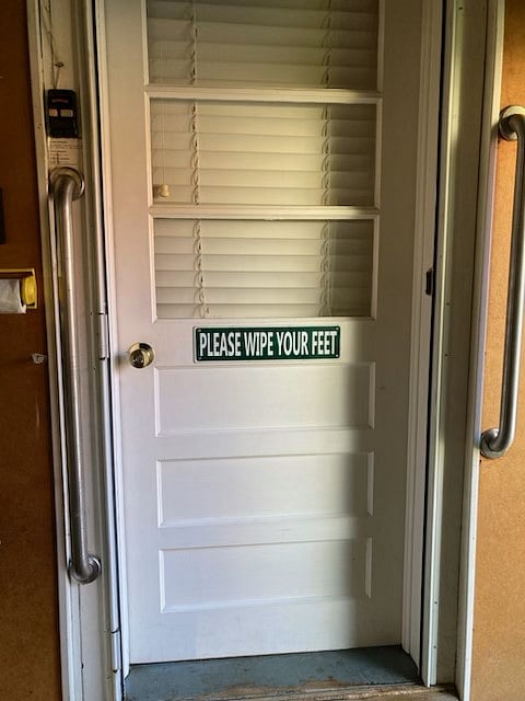 Door that leads to the kitchen from inside the garage. 