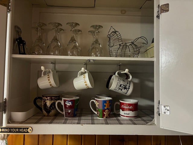 Left cabinet above green buffet