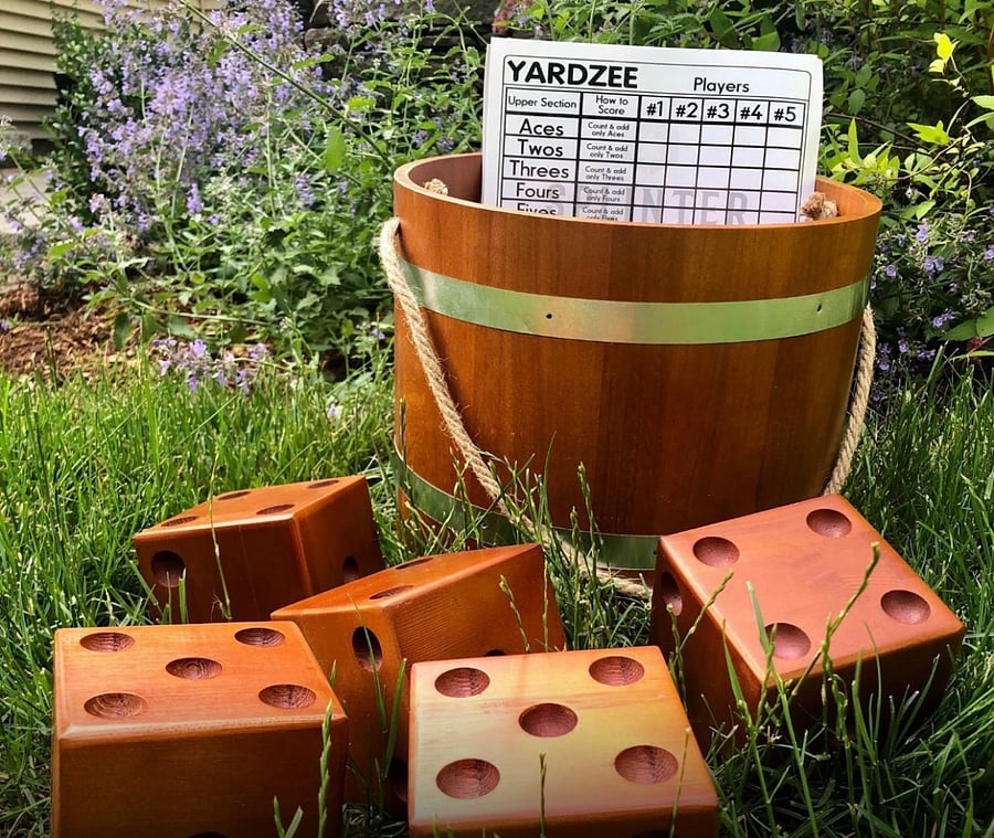 Enjoy an amazing hugebackyard filled with tropical plants and flowers, and play a game of Yard Yahtzee!