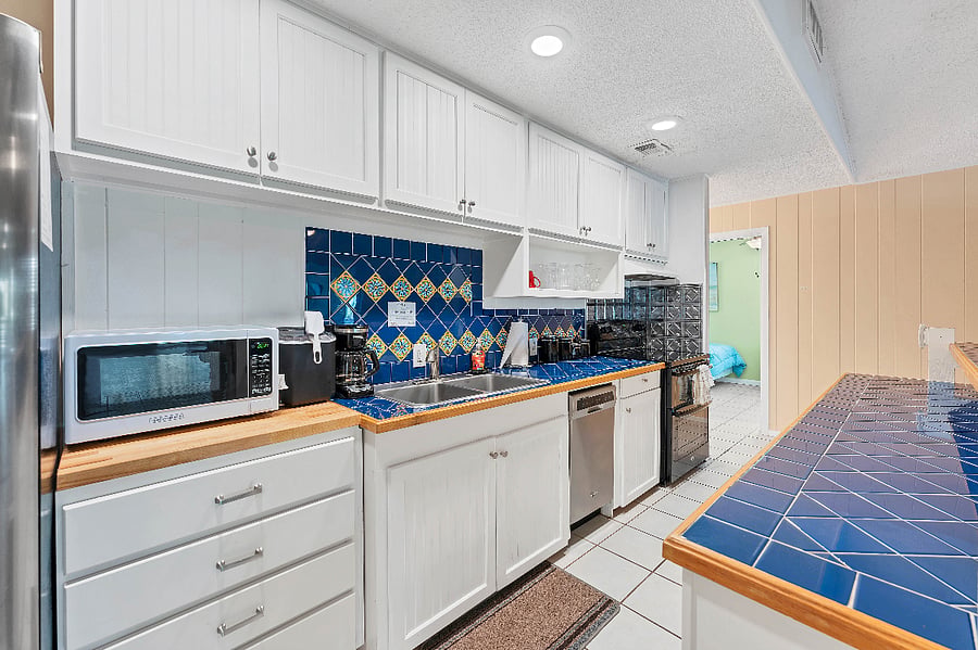 Bright, open kitchen is fully stocked with everything you need to feed large group!