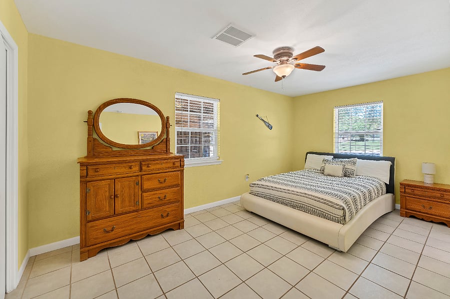 Cozy secondary bedroom with Queen bed. Includes nightstands with drawers and dresser for extra storage