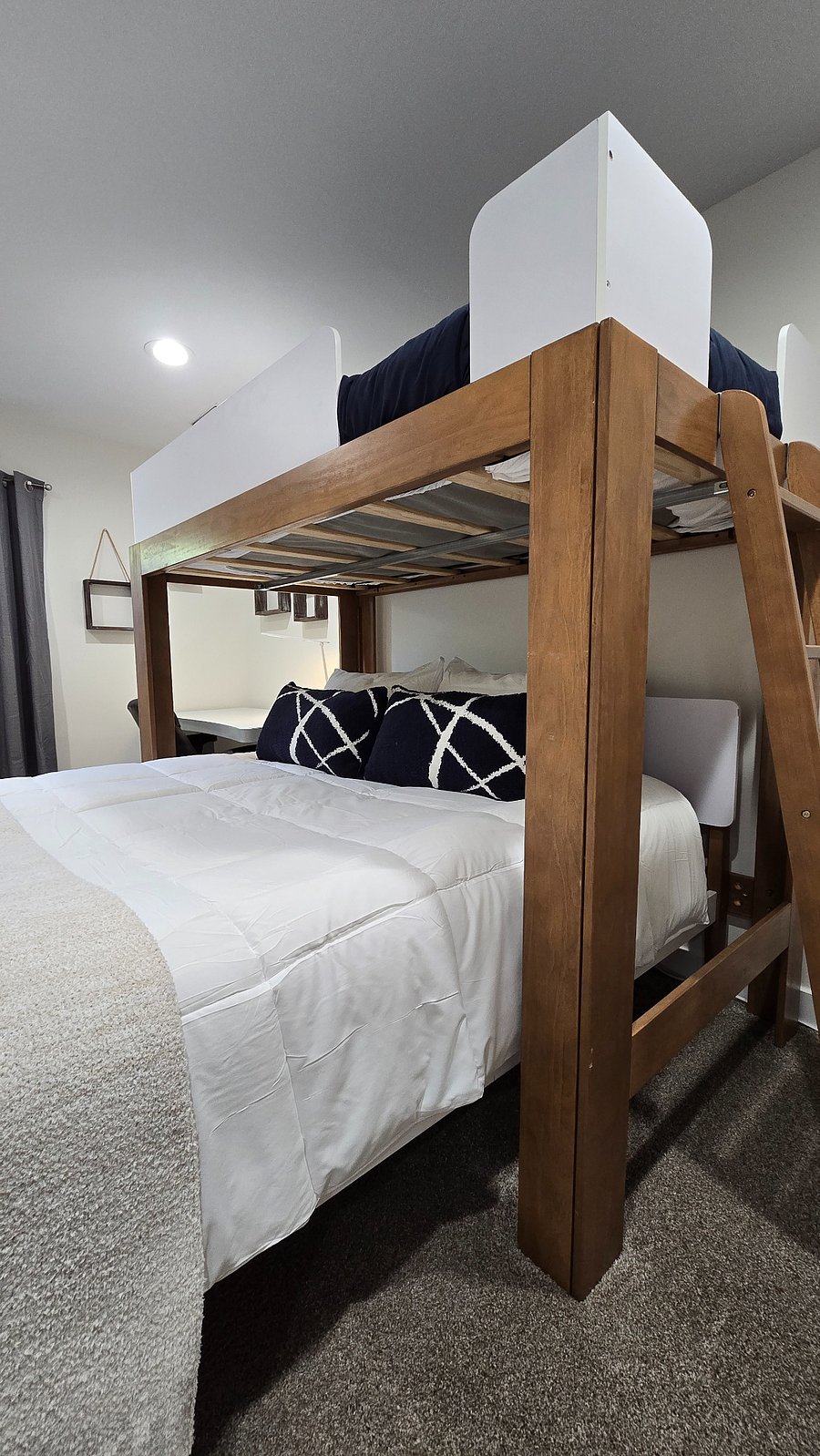 Your guest bedroom includes a comfy queen size bed with twin bunk bed above it. You also have an electric standing desk, desk lamp and chair. Additionally, you have a large closet with tons of storage space.