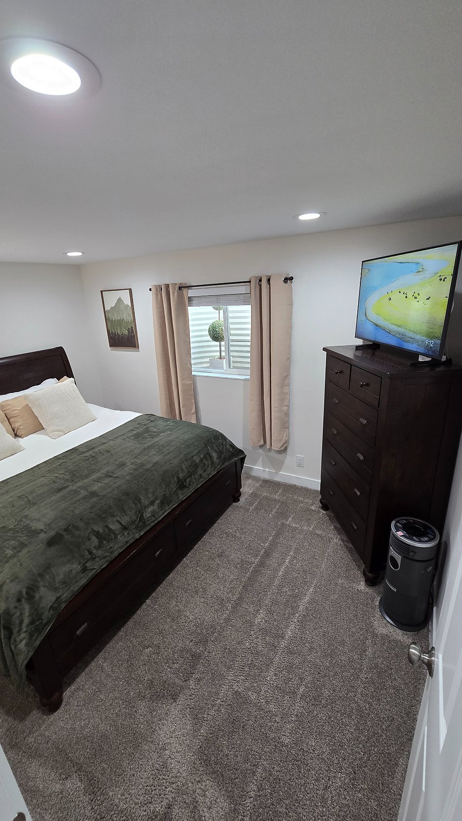 Your primary bedroom has a super spacious king size bed, with high end Bed Gear sheets, a new 42" UHD TV and Google Chromecast. You also have blinds and dark out curtains to ensure you get a calm and restful night of sleep. You also have dimming lights throughout the entire apartment.
Under the foot of the bed is additional storage drawers.