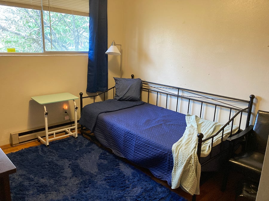 SE Bedroom.  Twin trundle bed. Awaiting a wall of vintage nautical maps and ships.