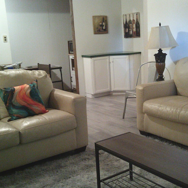 Looking towards kitchenette in alcove and bar area.