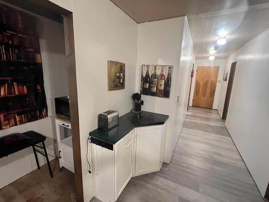 Kitchenette corner. Hallway to the exit.