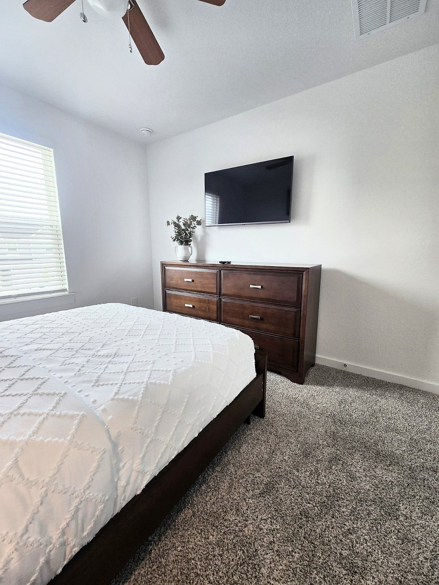 Queen bedroom room 2 with dress and smert tv