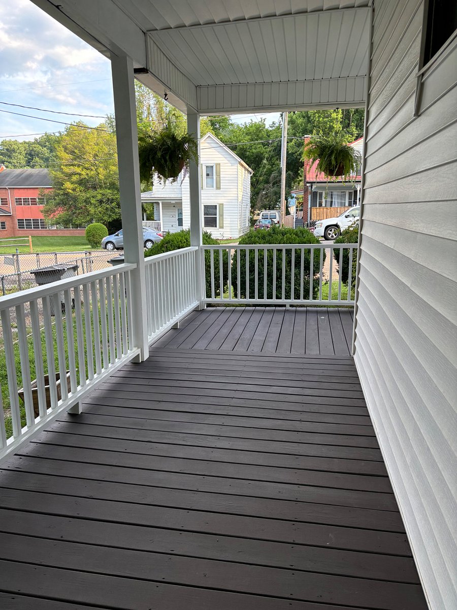 Front side porch leading to private front door.