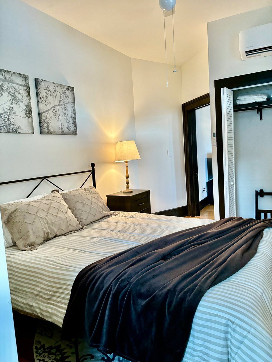 Queen bed with chest of drawers, closet and mini split for ac and heat.