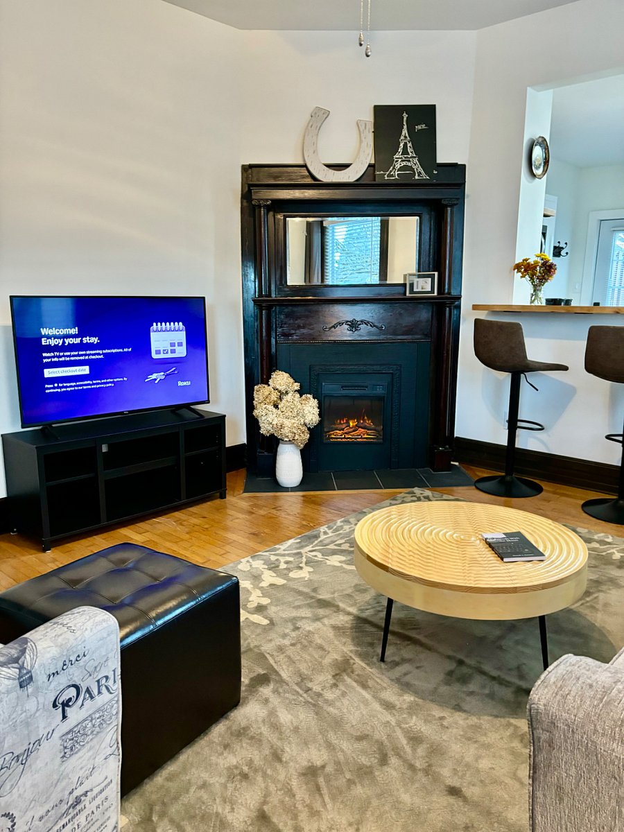 Living room with 50 Roku TV. Electric fireplace with heat. Seating for 2 at bar. Mini split for ac and heat.