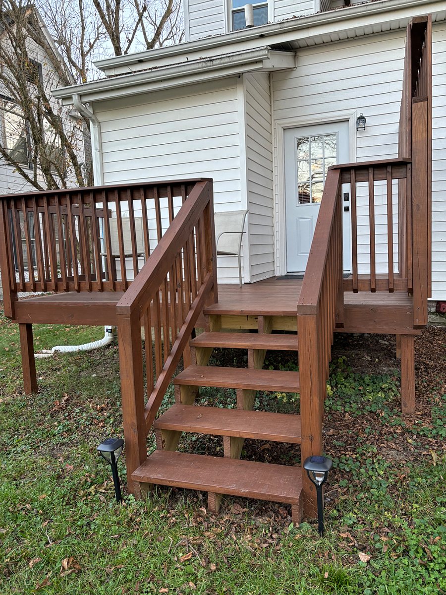Private back deck with seating for 2. Dusk to dawn porch light and railing lights.