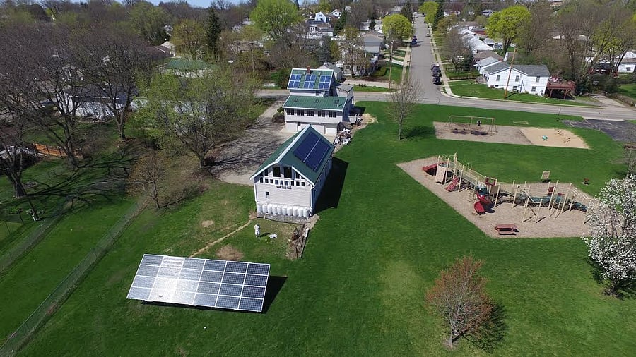 Minimal carbon footprint from solar energy offset and rain barrel usage.