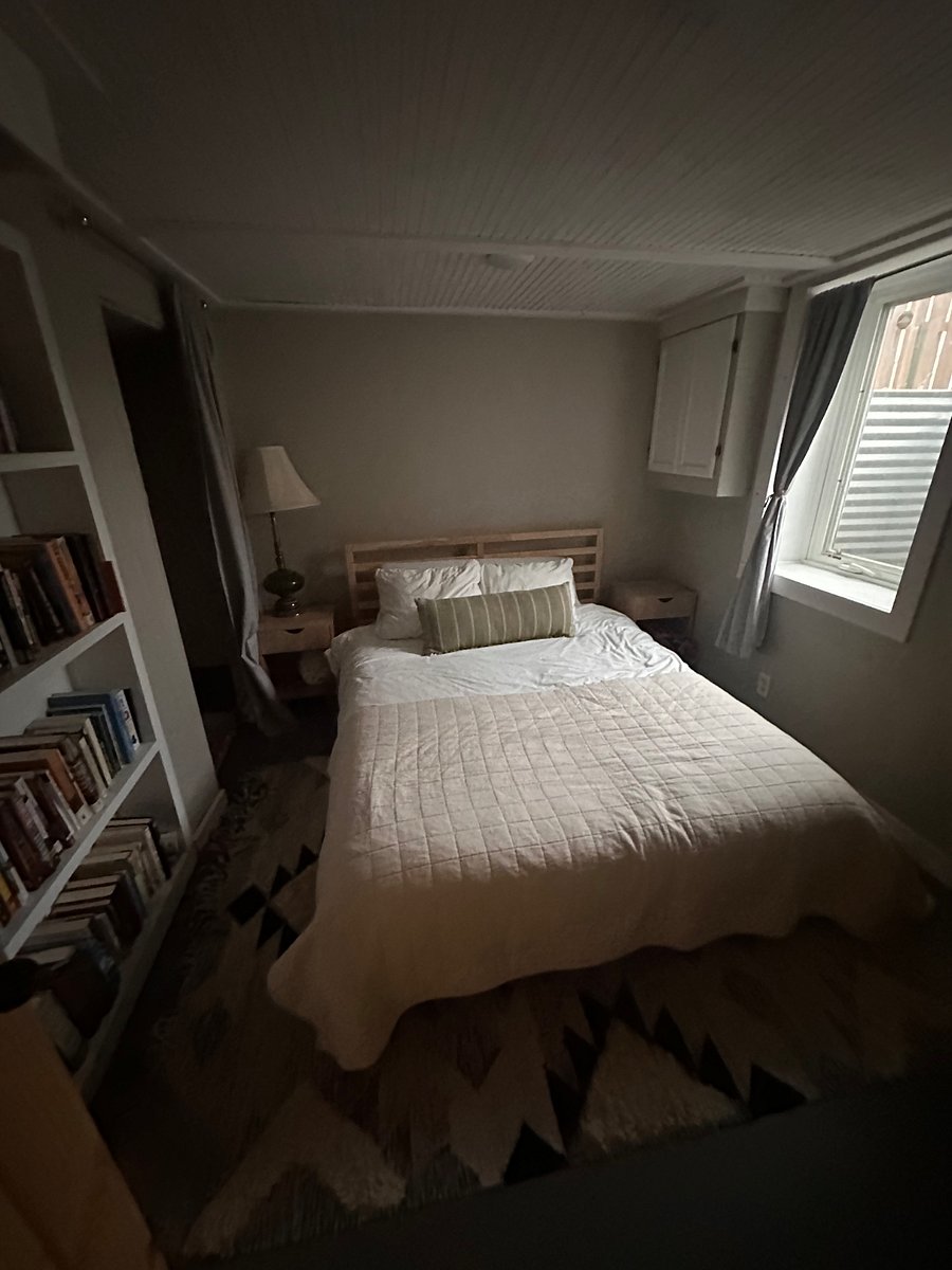 Downstairs bedroom with queen bed
