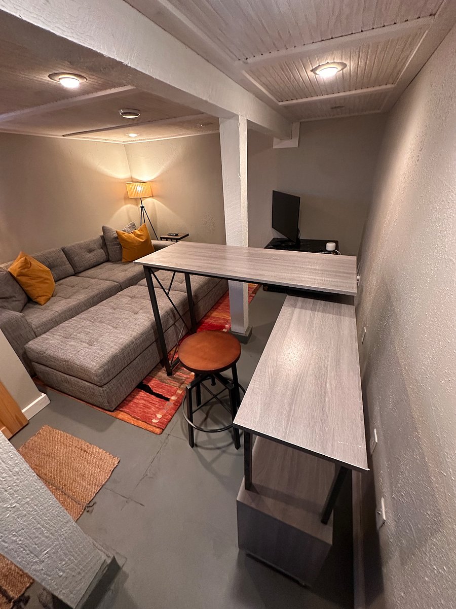 Second desk/workspace downstairs. Credenza extends to full desk as shown.
