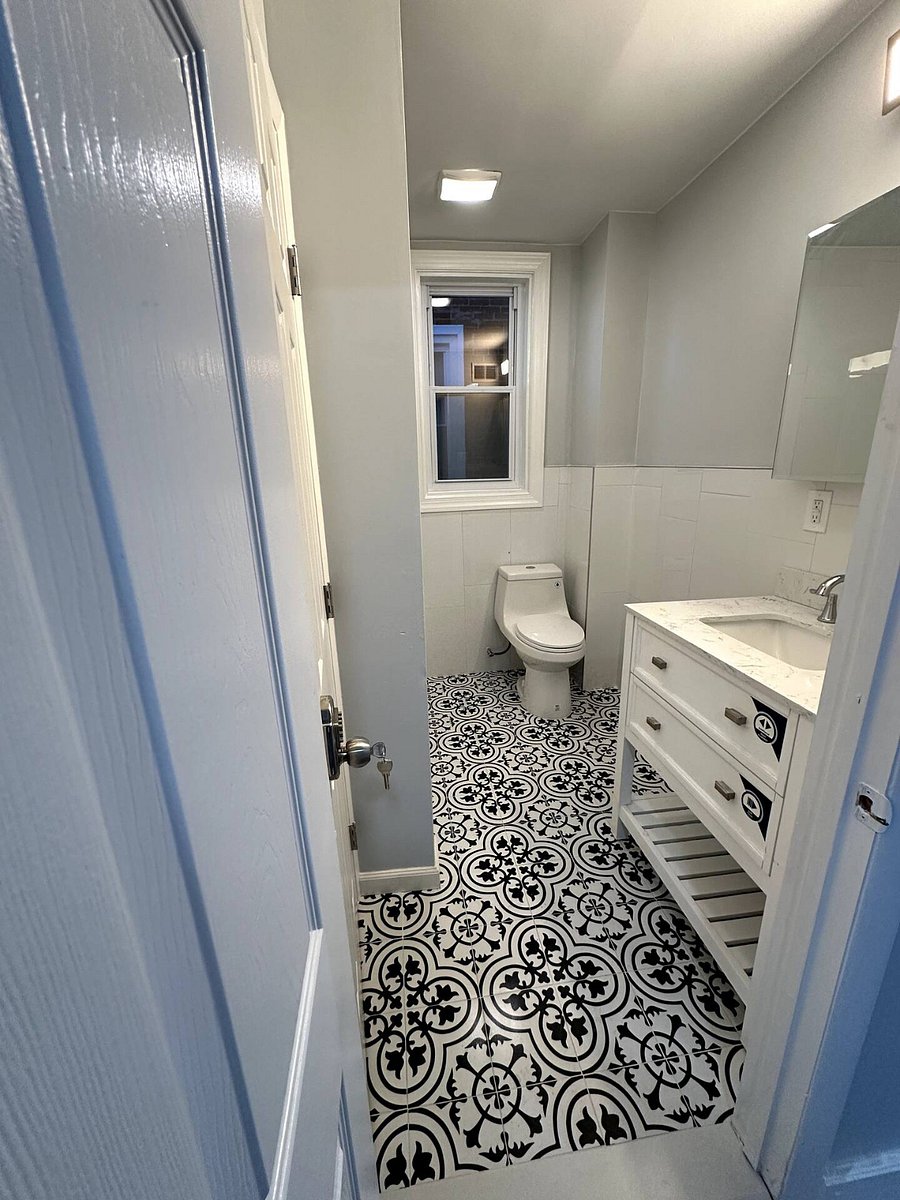 Bathroom Photo: "Sparkling clean modern bathroom stocked with plush towels and complimentary starter toiletries.