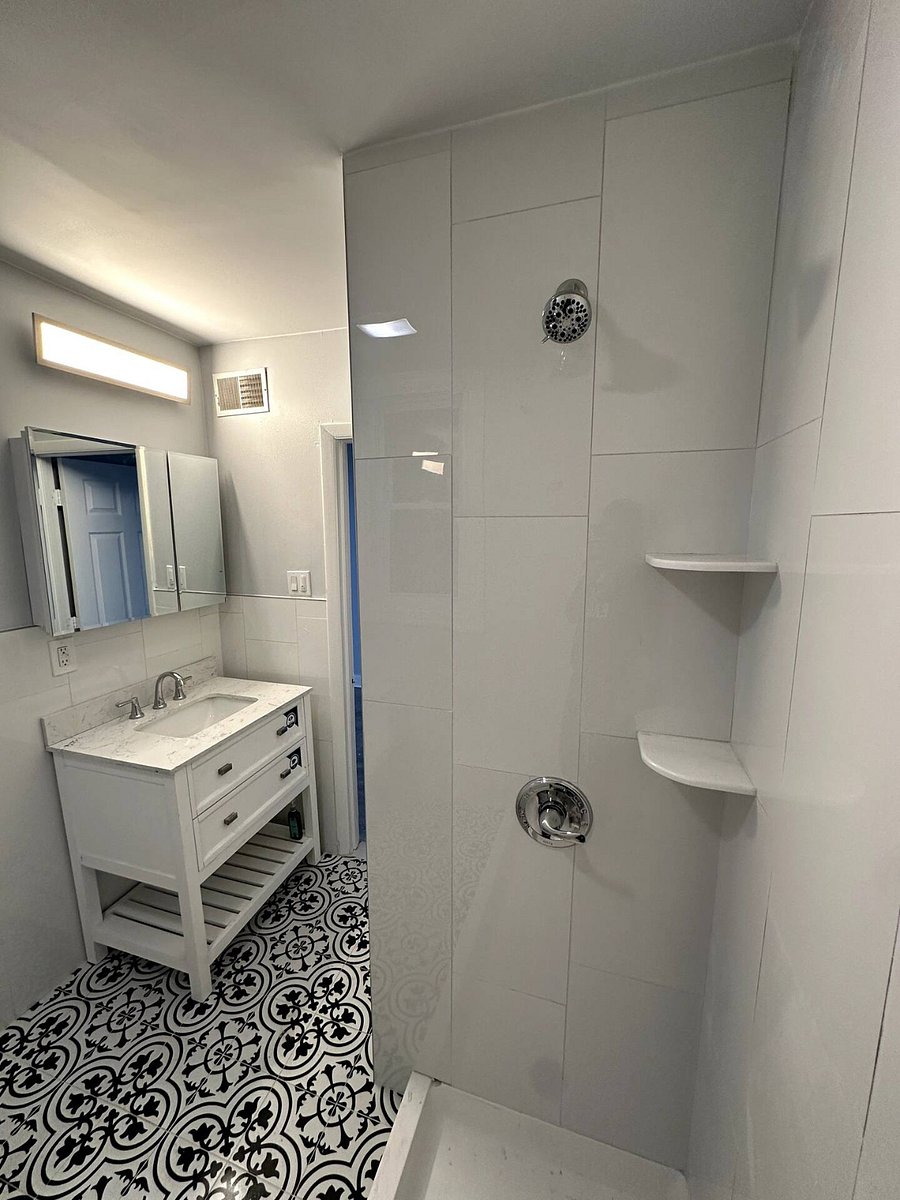 Bathroom Photo: "Sparkling clean modern bathroom stocked with plush towels and complimentary starter toiletries.