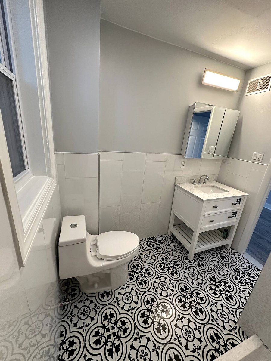 Bathroom Photo: "Sparkling clean modern bathroom stocked with plush towels and complimentary starter toiletries.