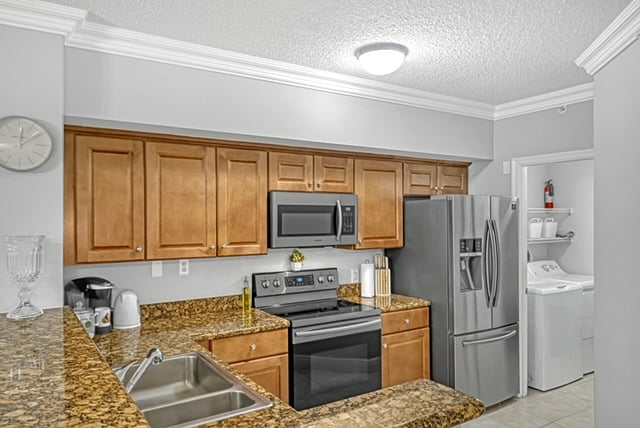 The kitchen has brand-new appliances and is fully equipped with pots/pans, silverware, a knife set, a Keurig, and condiments.