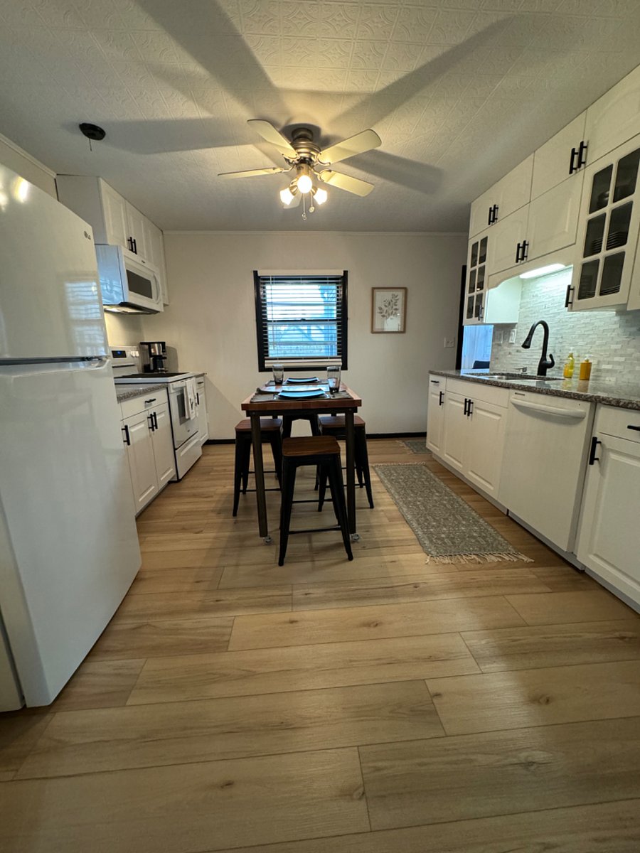 Kitchen with island on wheels to move easily for additional space