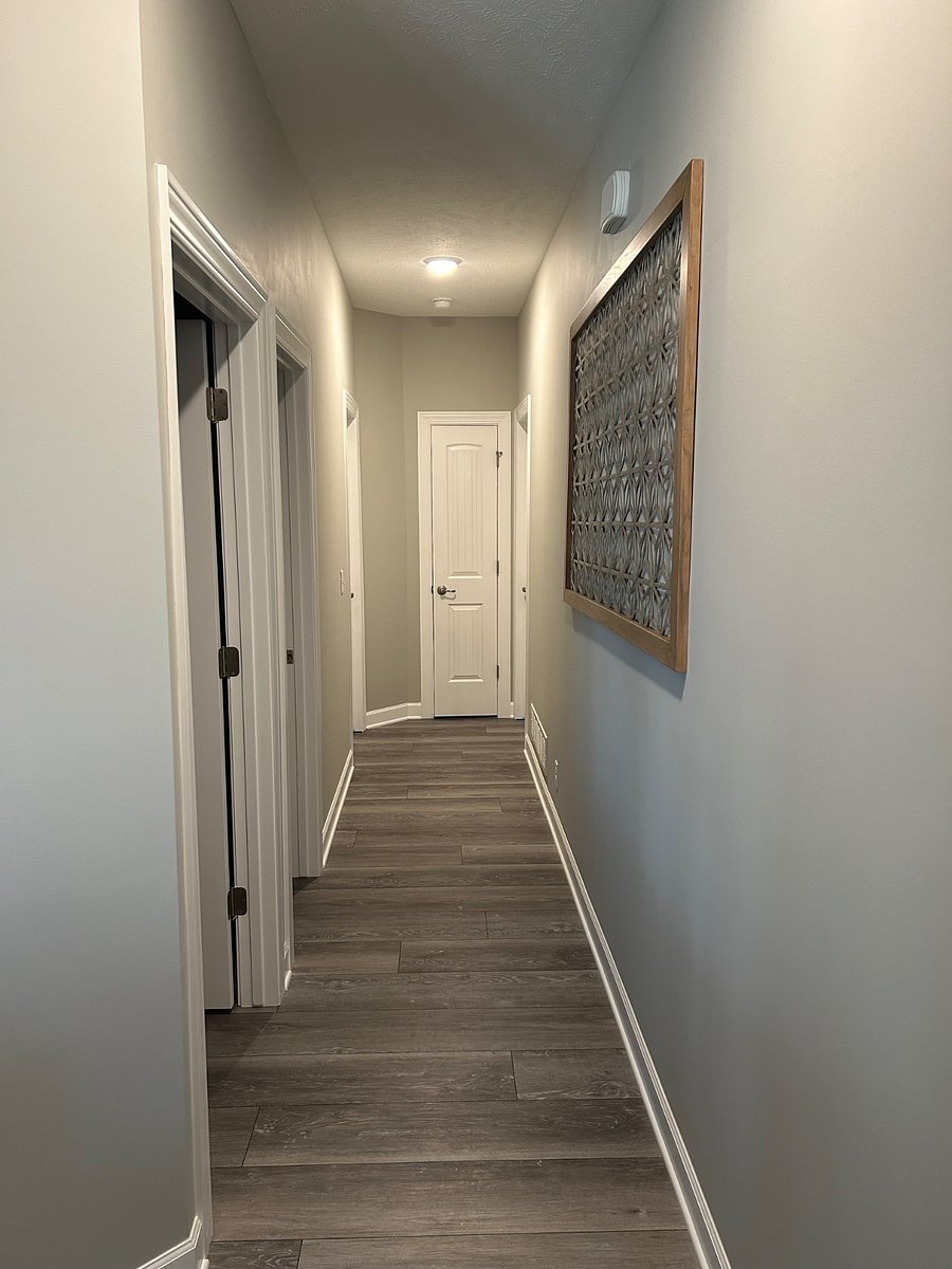 Bedroom hallway (looking from master). First closet on left is the laundry room, then the guest bathroom, and the two final closets at the end of the hallway are two guest bedrooms