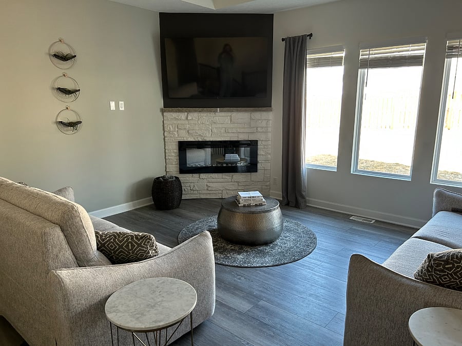 Living room with power reclining, zero gravity couches and 65" tv